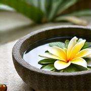 Traditional Balinese spa treatment with frangipani flowers
